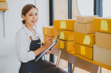 Small business owners online are checking their orders. where customers place orders and check the orders that the customers have ordered of online retailers - online shopping