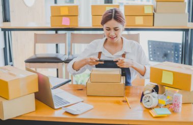 Small business owners online are taking pictures of their products and offering them to customers who will place their orders. and check the orders that the customers have ordered of online retailers - online shopping