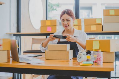 Small business owners online are taking pictures of their products and offering them to customers who will place their orders. and check the orders that the customers have ordered of online retailers - online shopping