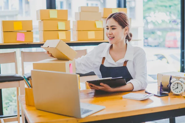 Small business owners online are checking their orders. where customers place orders and check the orders that the customers have ordered of online retailers - online shopping