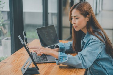 Female programmers are thinking and planning to work on programming, software coding and web design.Concept technology development.