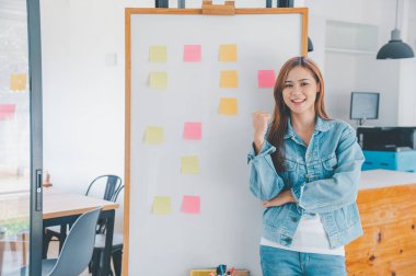 Web designers creating planning and analyzing with Colorful sticky notes on the office board.web design concept