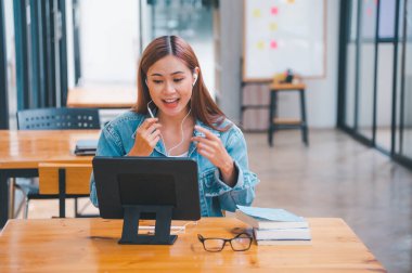 young student wearing small talk studies online, distance learning, and keeps up to date on the global coronavirus pandemic