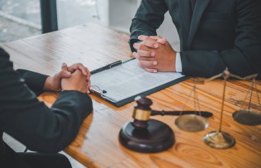 Law theme, mallet of the judge, law enforcement officers, evidence-based cases, and documents taken into account.	