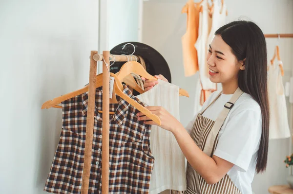 Small business owners are organizing and arranging a small store to welcome customers and get customers online. And check the orders that customers have ordered of online retailers - online shopping.