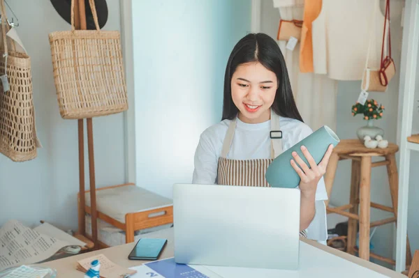 Small business owners inspecting merchandise And talk to customers to buy products and take orders that customers order from online retailers - online shopping.