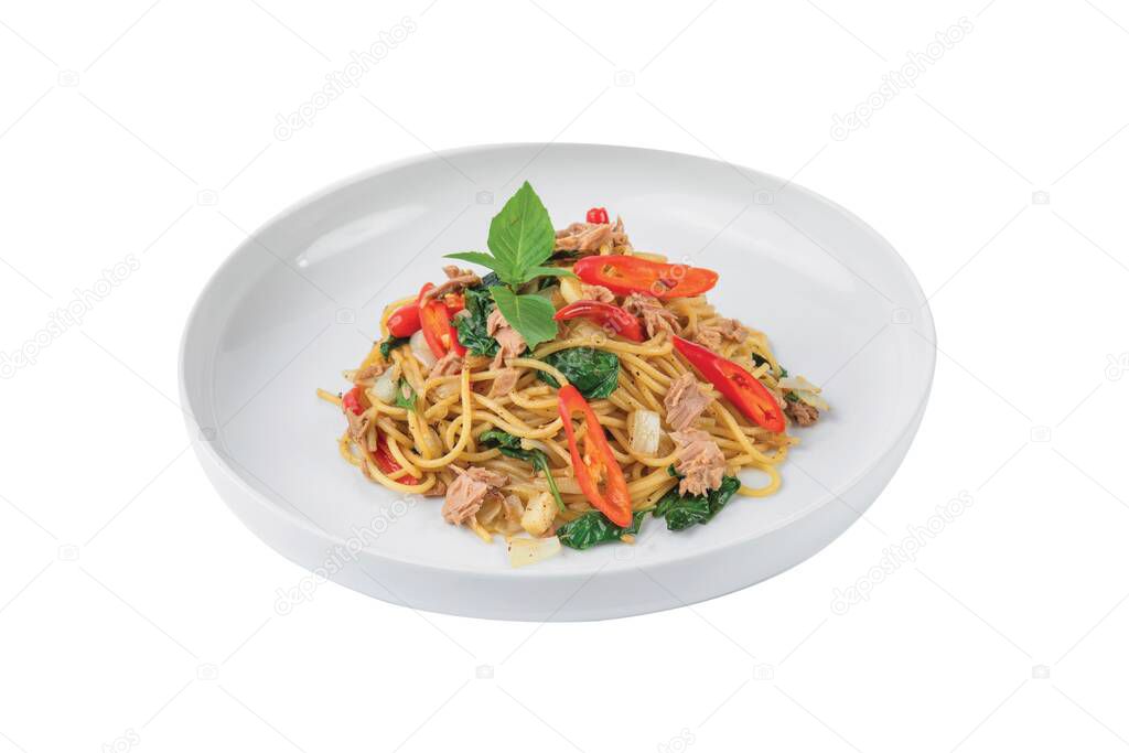 Spaghetti with Tuna, Parsley and pepper on a white plate