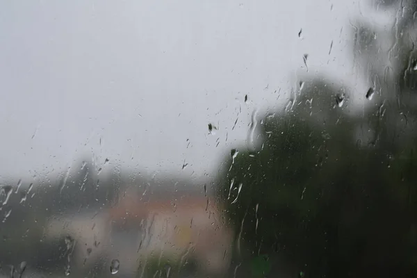 Raindrops on the window, rainy autumn, background of drops on glass.