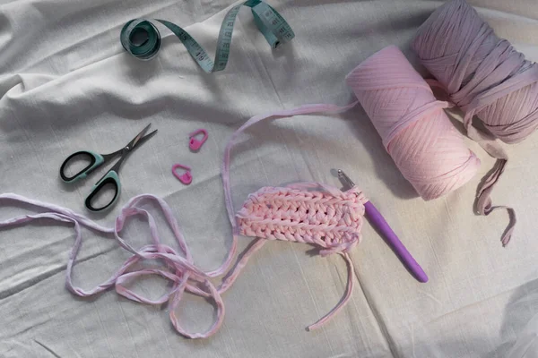 Crochet bag crochet element, yarn queens, scissors, centimeter. Pastel colors. Background for content. Knitting. Hobby. Flatley.