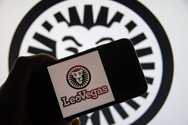 Rheinbach, Germany  21 April 2022,  The brand logo of the online casino "LeoVegas" on the display of a smartphone (focus on the brand logo)