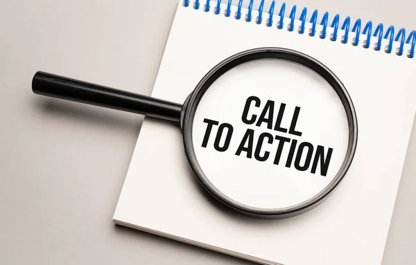 Magnifying glass with the word Call To Action on chart background