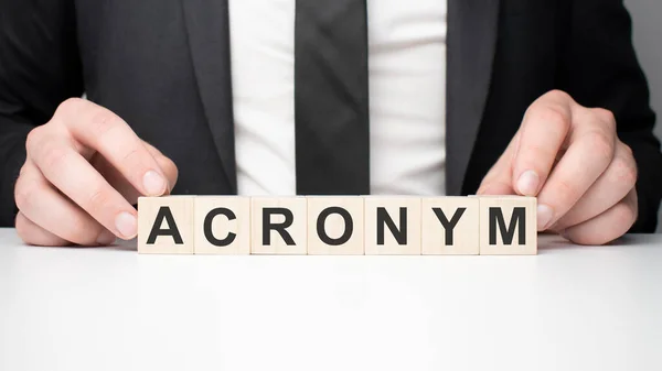 Businessman Holding Wooden Block Businessman Watch Wooden Cubes Text Acronym — Stock Photo, Image