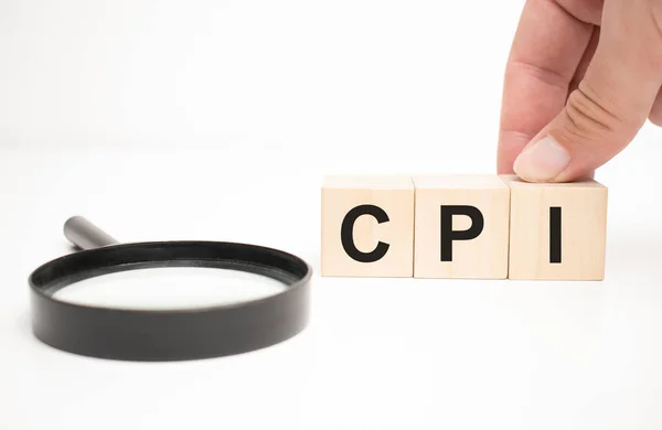 Cpi Text Trä Kub Block Och Hand Hålla Förstoringsglas Bordet — Stockfoto