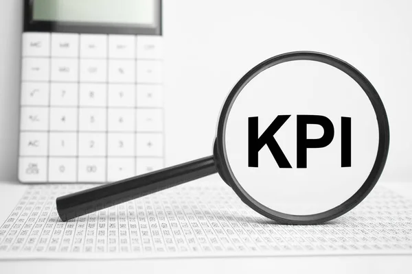 Magnifying Glass Text Kpi White Table Calculator — Stock Photo, Image