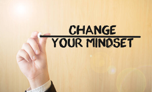 Hand writing inscription CHANGE YOUR MINDSET, with marker,business concept