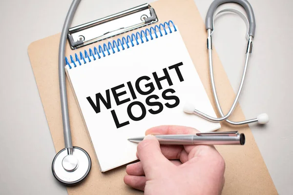 Білий Блокнот Словами Weight Loss Стетоскоп Синьому Фоні Медична Концепція — стокове фото