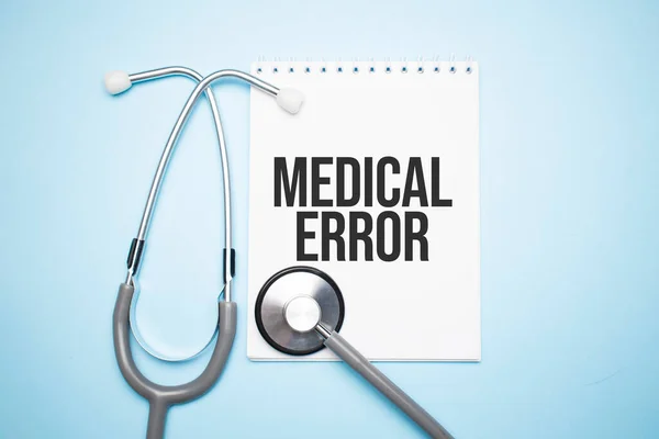 Paper Text Medical Error Blue Background Stethoscope Pills — 图库照片
