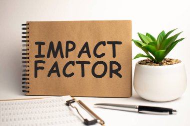 Ofis işyerindeki IMPACT FACTOR kağıt not defteri