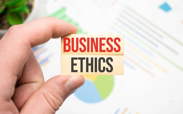 Cropped View Hands Holding Wooden Cube Business Ethics Lettering Work — Stock Photo, Image