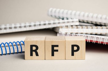 rfp acronym on wood block cubes on wooden table over light blue gradient background, Frequently asked questions, Business customer service and support concept