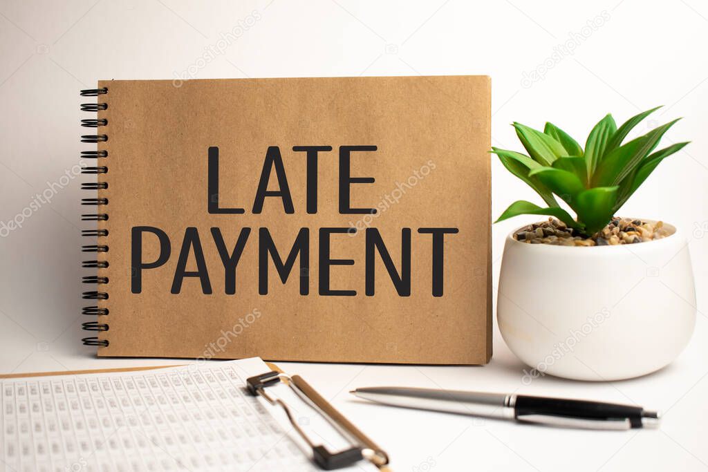 LATE PAYMENT paper notepad on office work place