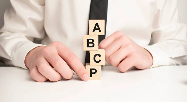 Closeup Man Add More Some Alphabets Wood Cubes Row Complete — Stock Photo, Image