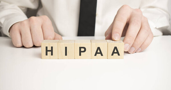 Man made word hipaa with wood blocks