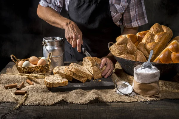 Baker Cutting Grain Bread Rustic Table — Stock Photo, Image