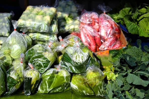 Fresh vegetables packed in plastic bags are sold in the fresh market and street food market in Thailand.