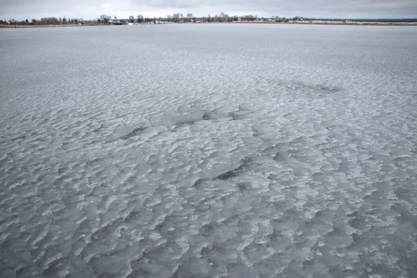Rough cavernous texture on an ice-covered lake — Stock Photo, Image