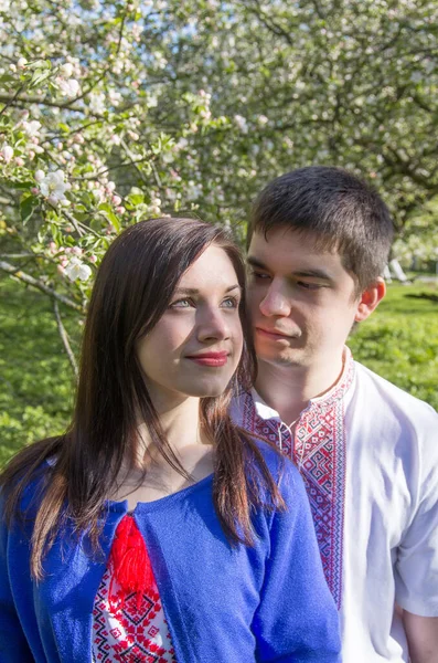 Young Loving Couple Man Woman Embroidered Shirts Flowering Tree Spring — ストック写真