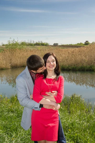 Loving Couple Meadow River Warm Summer Day Girl Red Dress — 스톡 사진