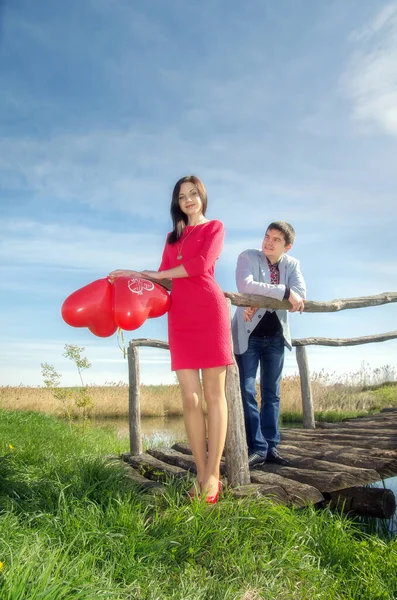 Man Woman Red Dress Red Heart Shaped Balloons Old Wooden — 스톡 사진