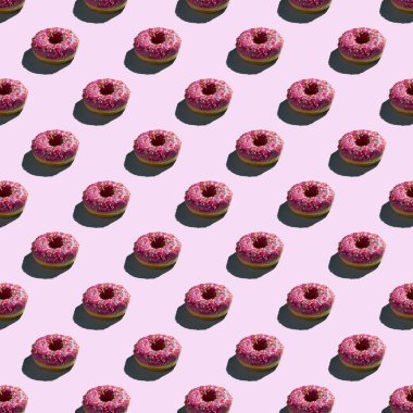 Düz, pürüzsüz pembe donut deseni.