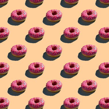 Düz, pürüzsüz pembe donut deseni.