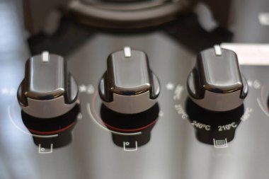 Buttons. Modern gas stove burner, great design for any purposes. side view, close up image, Brazil, South America. Photo zoom