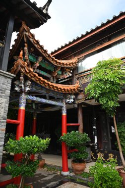 Exploring the ancient town of Lijiang in Yunnan province of China and admiring the ornate and interesting wooden buildings