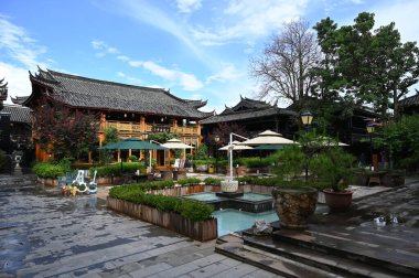 Exploring the ancient town of Lijiang in Yunnan province of China and admiring the ornate and interesting wooden buildings