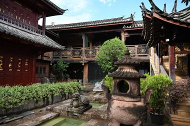 Exploring the ancient town of Lijiang in Yunnan province of China and admiring the ornate and interesting wooden buildings