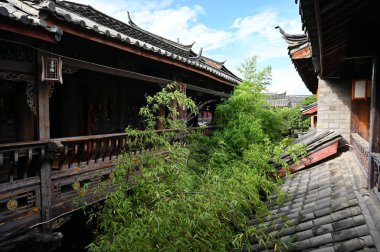 Exploring the ancient town of Lijiang in Yunnan province of China and admiring the ornate and interesting wooden buildings