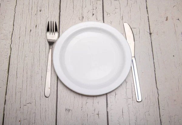 Empty Plain White Plate Cutlery Signs Use Rustic Wooden Surface — Stockfoto