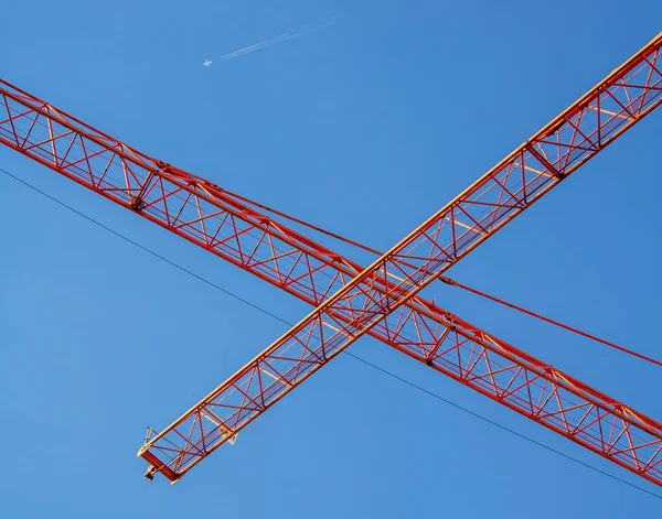 Perspective View Two Orange Crane Booms Crossing Each Other Front — Stock Photo, Image