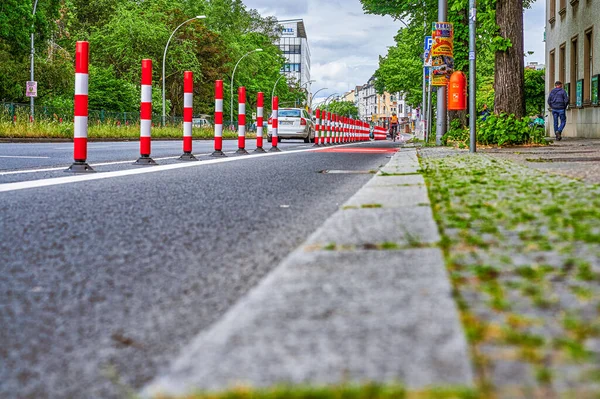 Berlin, Germany - May 29, 2022: Cyclist in a protected bike lane on a main street to improve road safety.