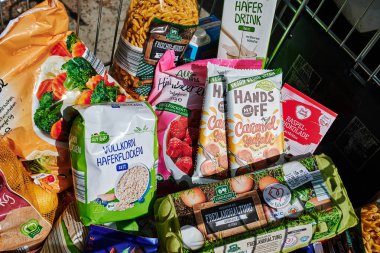 Berlin, Germany - September 1, 2022: View into a full shopping cart with various products for daily needs.