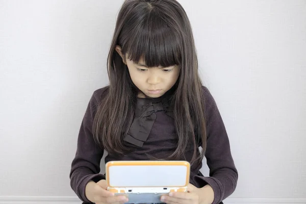 Japanese Girl Playing Video Game Console Floor Years Old — стоковое фото