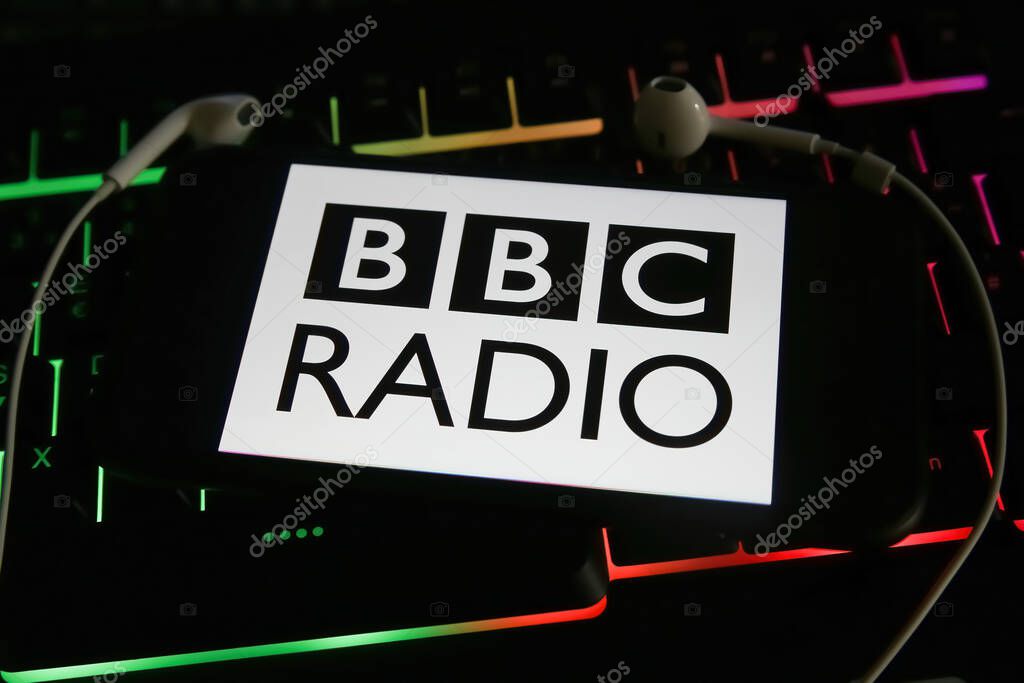 Viersen, Germany - January 9. 2022: Closeup of mobile phone with logo of british bbc radio station on computer keyboard