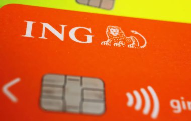 Versen, Germany - July 9. 2022: Closeup of orange color maestro ec girocard with ing-Diba logo lettering