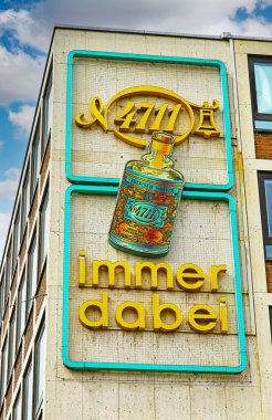 Cologne (Heumarkt), Germany - July 9. 2022: Closeup of retro vintage advertising for german eau de cologne 4711 at house facade