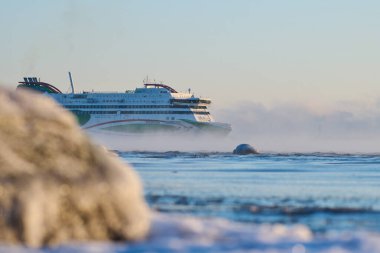 Helsinki, Finland - December 5, 2021: Tallink M/S Megastar ferry departing to Tallinn from Helsinki in extremely cold winter conditions.