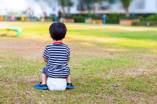 Asian Little Boy Sitting Alone Soccer Ball Lawn — Stock Photo, Image